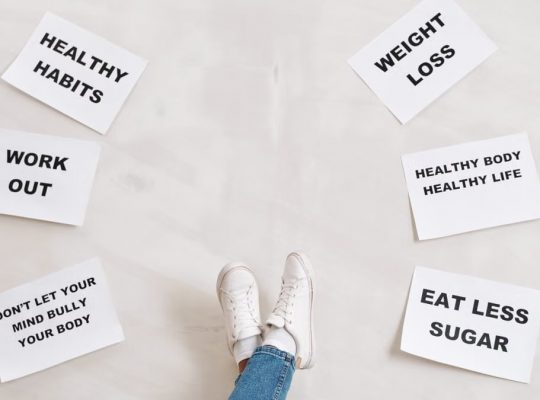 Inspirational health and fitness messages with shoe-clad feet, promoting healthy habits and wellbeing.
